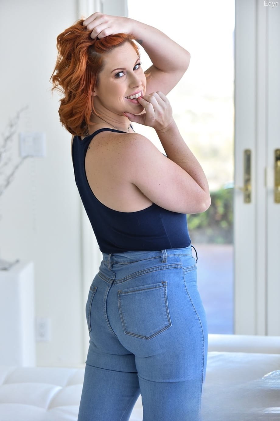 Redhead model doffs blue jeans on way to showing butthole and vagina