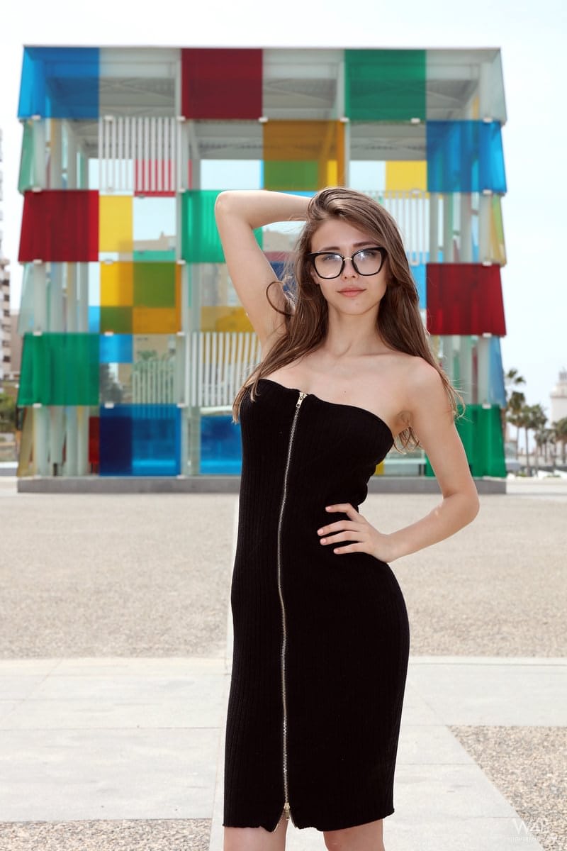 Nerdy teen Milla shows her tits and ass on a lookout spot over her town