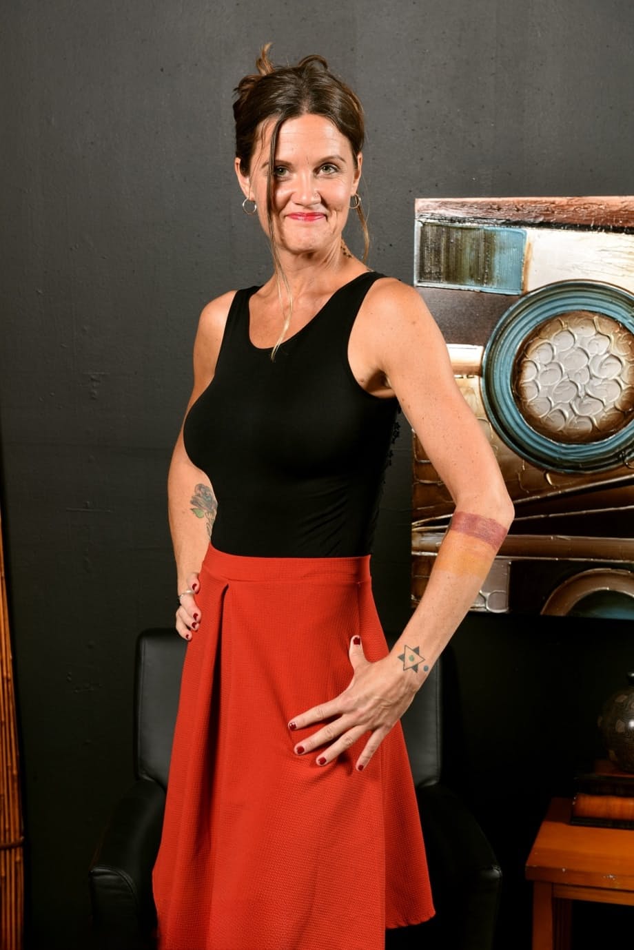 Older lady Cj removes red skirt on her way to posing naked