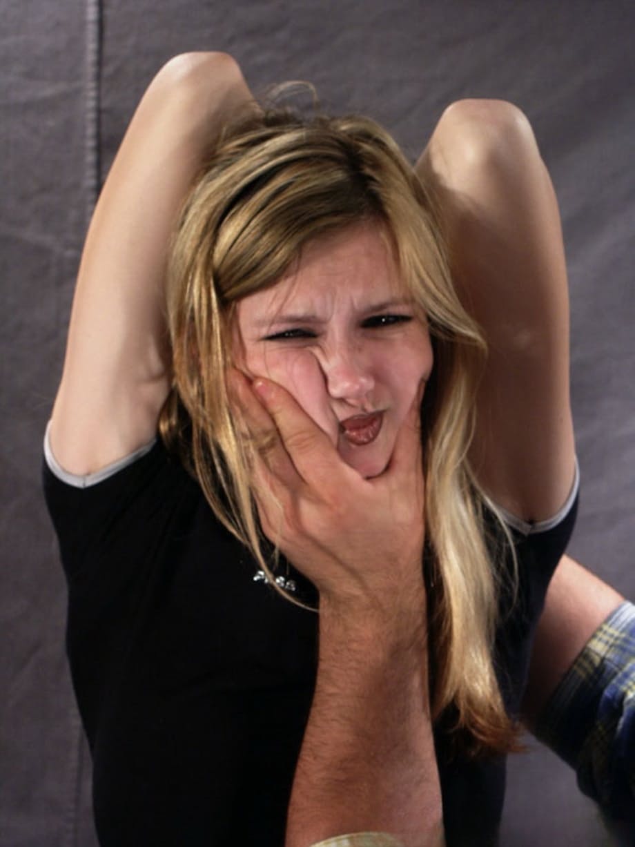 Restrained blonde girl is forced into having to smoke a cigarette