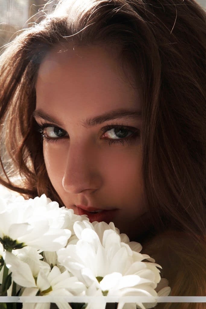 Sultry teen Valery Leche gets into a petal filled tub after removing lingerie