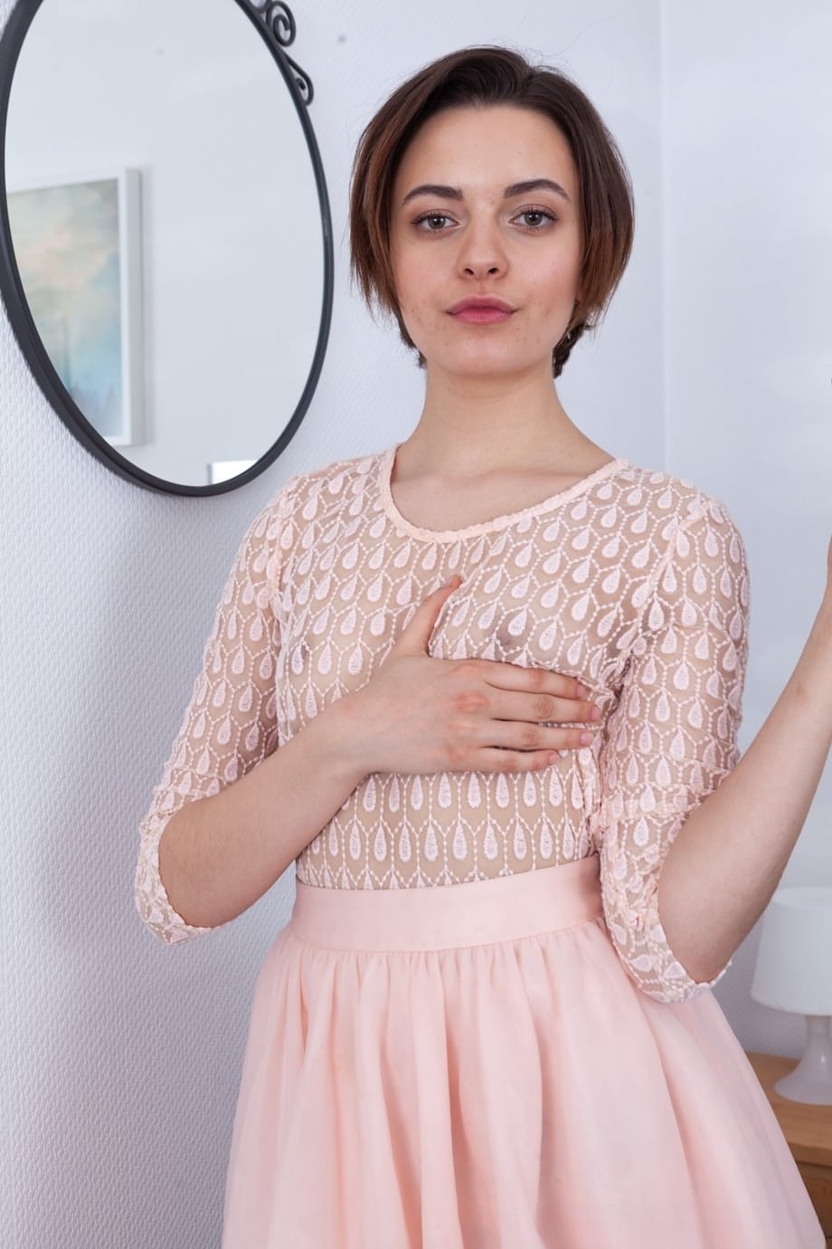 Amateur girl Melody Sweet parts her natural pussy once she's naked on a bed