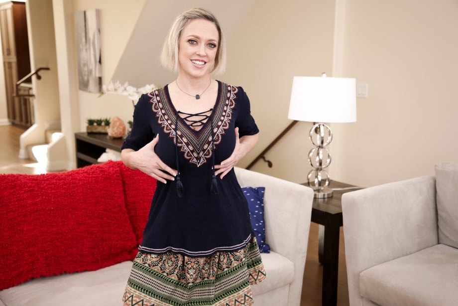 Caucasian woman unleashes her huge breasts before slipping off her underwear
