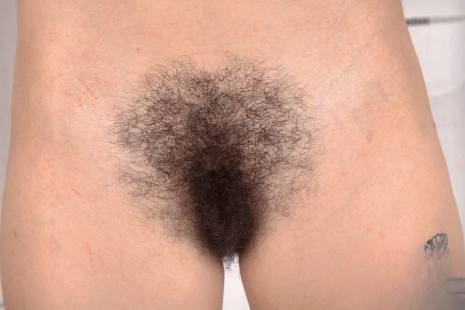Solo girl Sweet Mary Jane puts her natural beaver on display in solo action