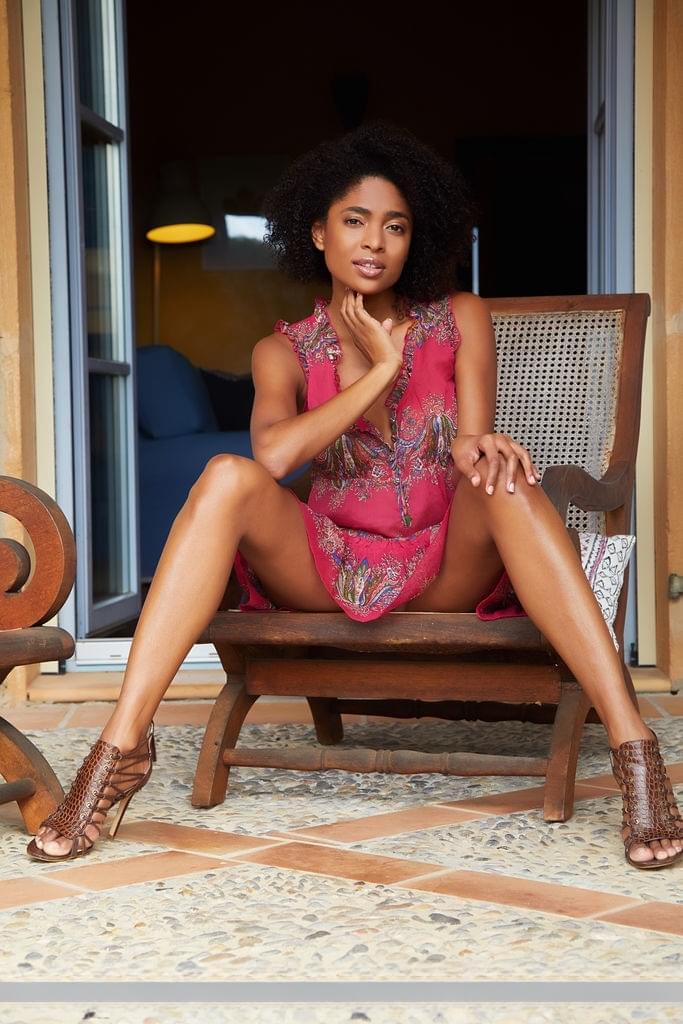 Black teen Luna C spreads her long legs while showing her tight ass and pussy