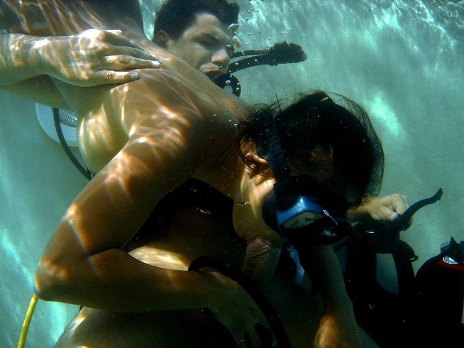 Asian scuba diver gives a BJ underwater before fucking beside pool