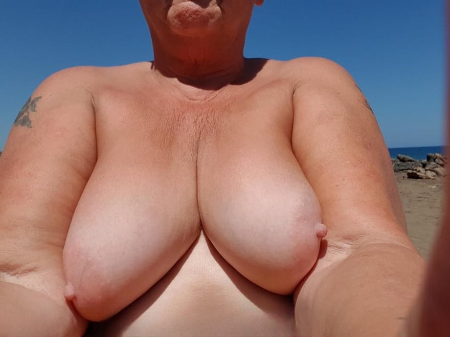 Old SSBBW Val Gasmic dyes her hair red before exposing herself on the beach