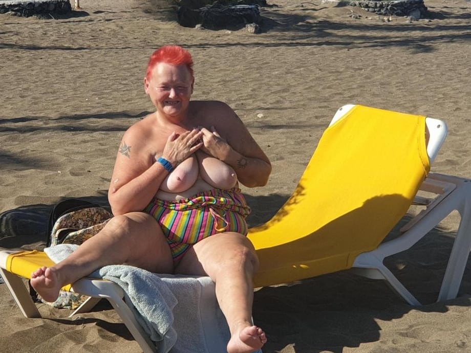Old SSBBW Val Gasmic dyes her hair red before exposing herself on the beach