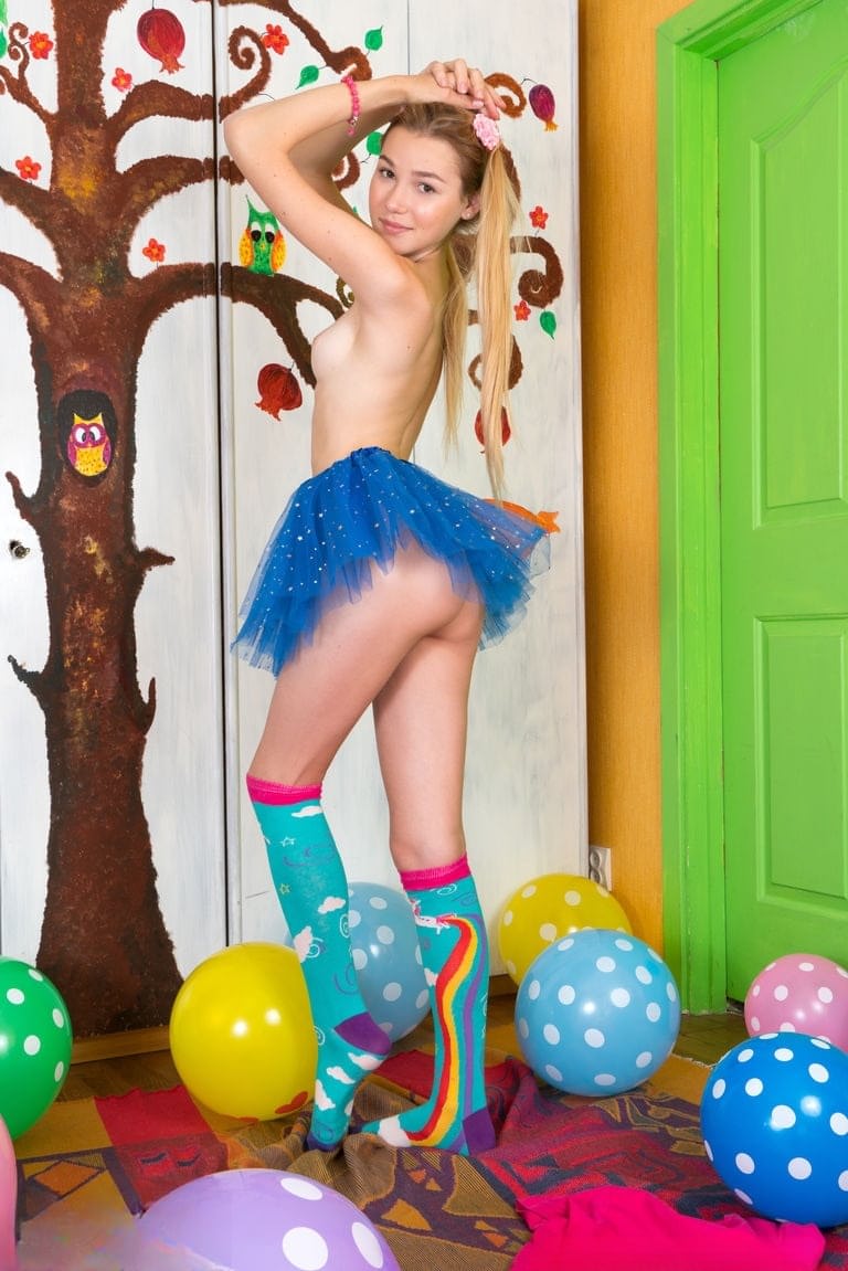 Young looking girl sports a no panty upskirt before getting nude amid balloons