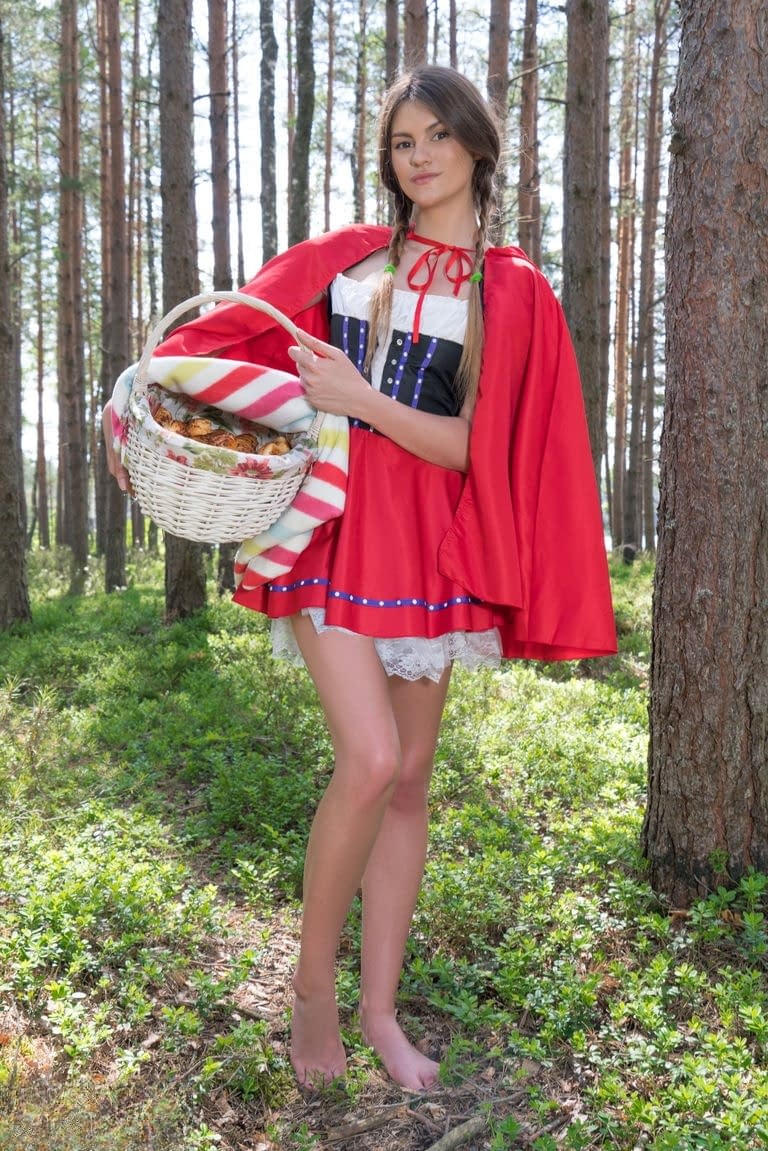 Teen amateur removes a Little Red Riding Hood outfit to get naked in the woods