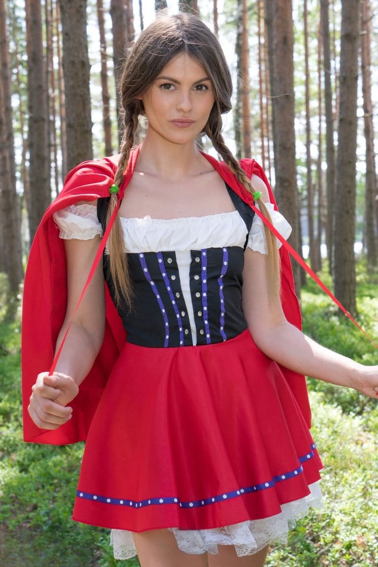 Teen amateur removes a Little Red Riding Hood outfit to get naked in the woods