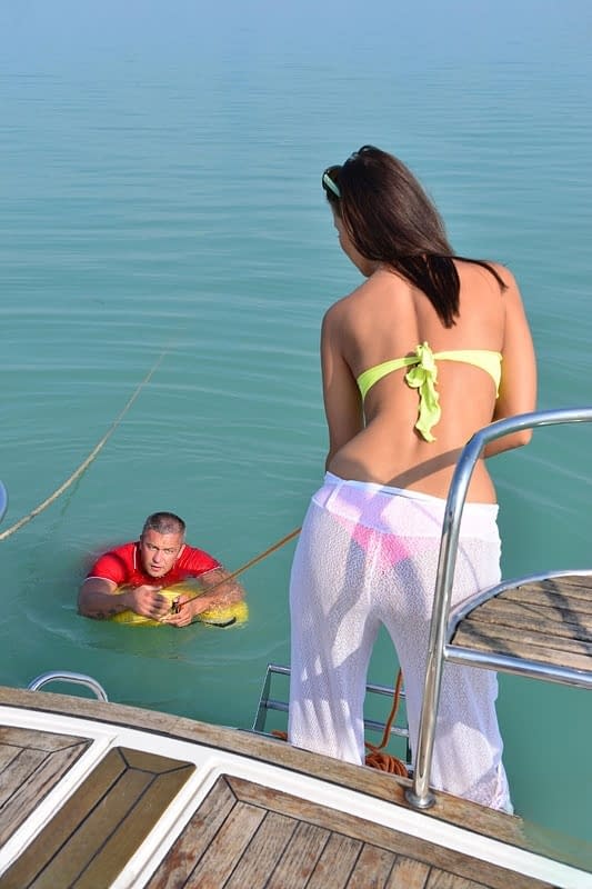 Hot brunette Vicky Love seduces and fucks a guy on the deck of a boat