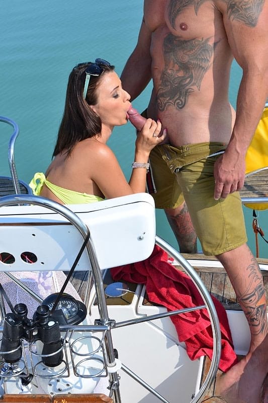 Hot brunette Vicky Love seduces and fucks a guy on the deck of a boat