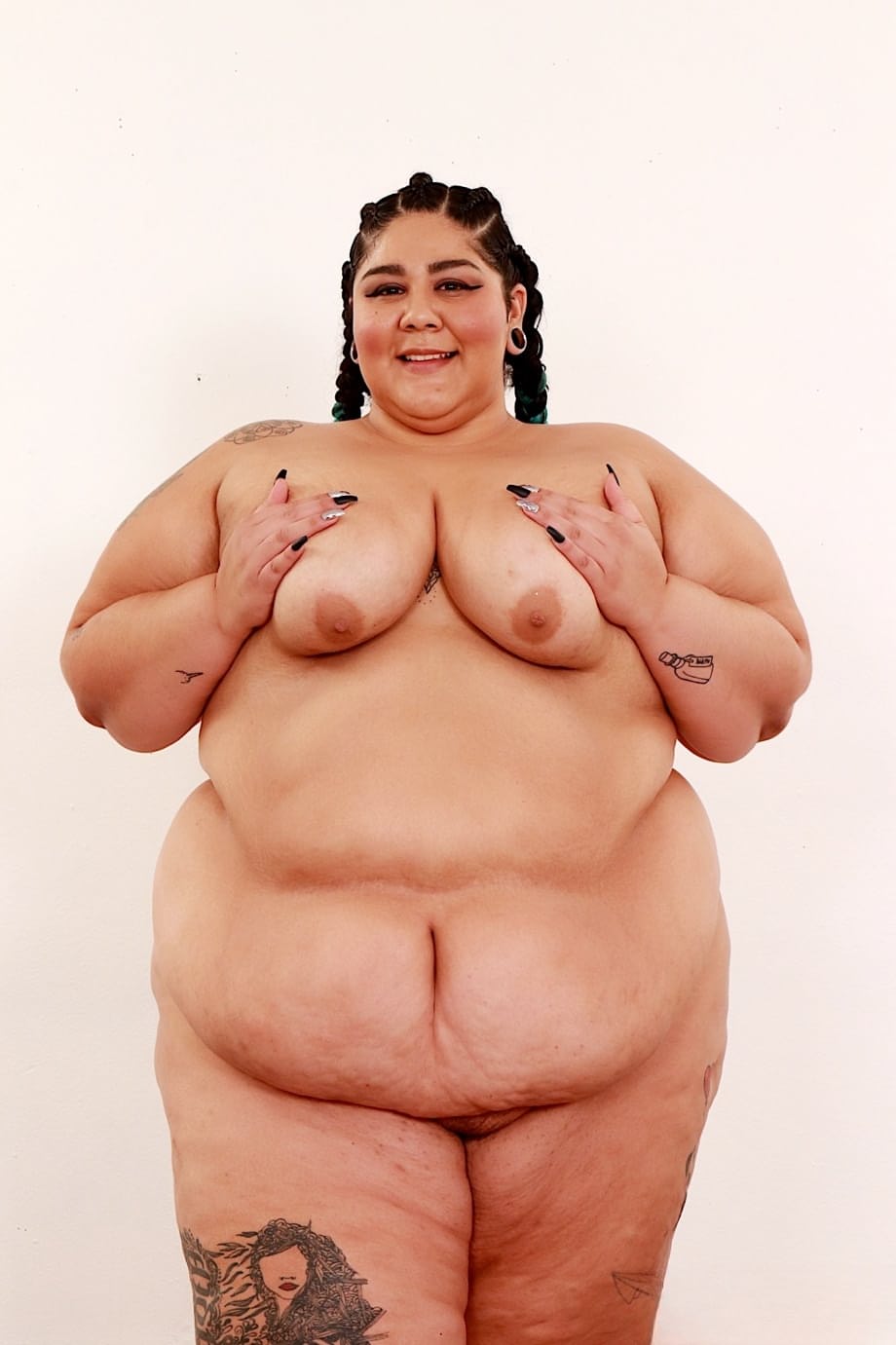 SSBBW Crystal Blue removes a bra and panty set to pose naked in shoes