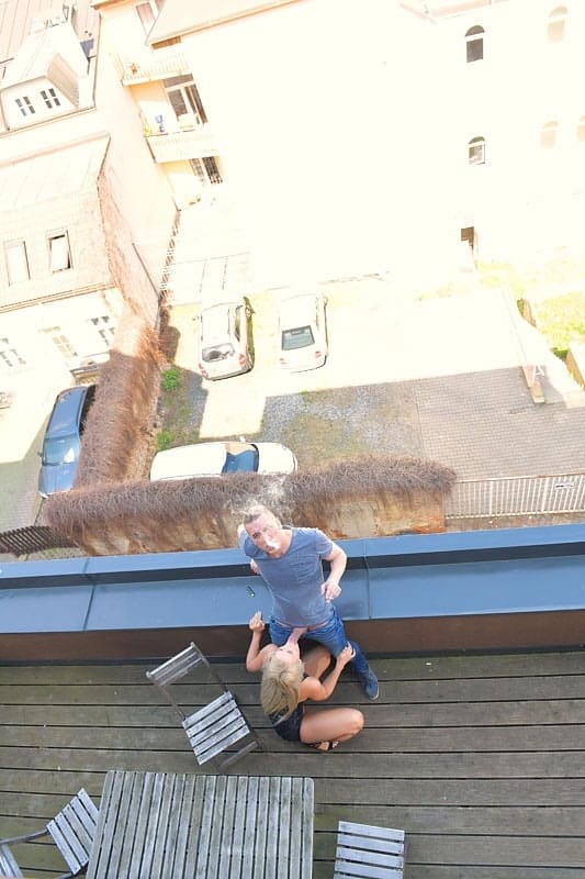 Hot blonde Katy Sky finger fucks her pussy while sucking cock on a balcony