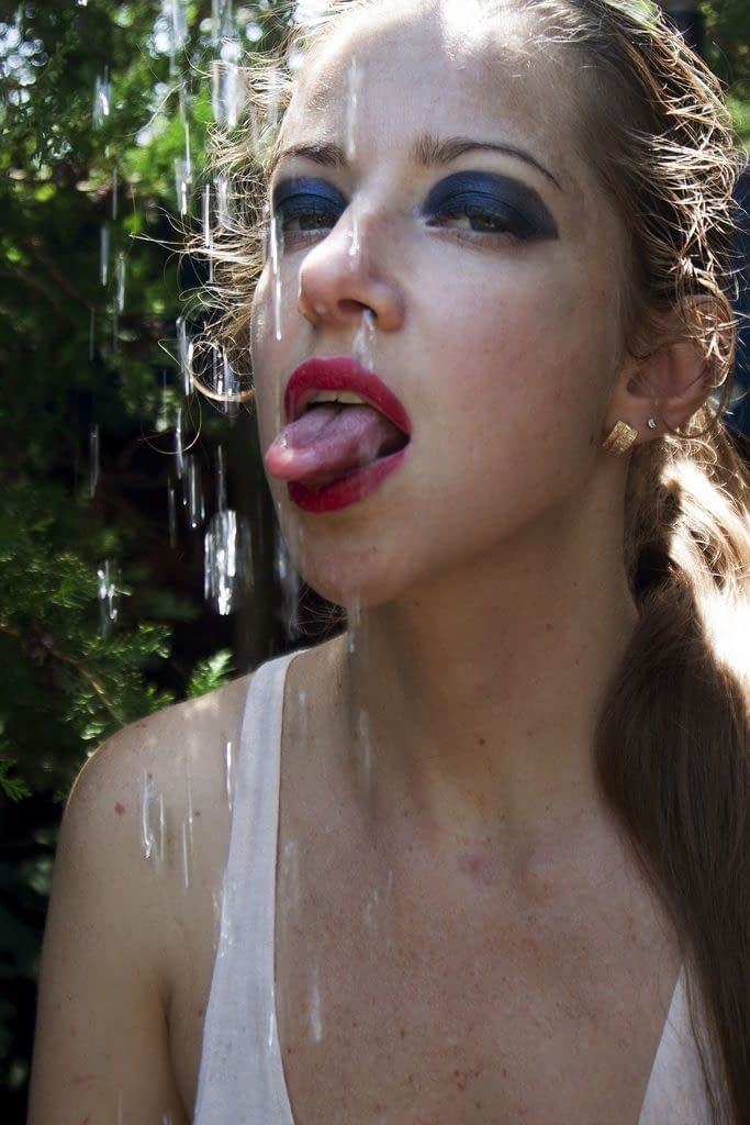 Teen solo girl Mika A rips open her pantyhose while taking an outdoor shower
