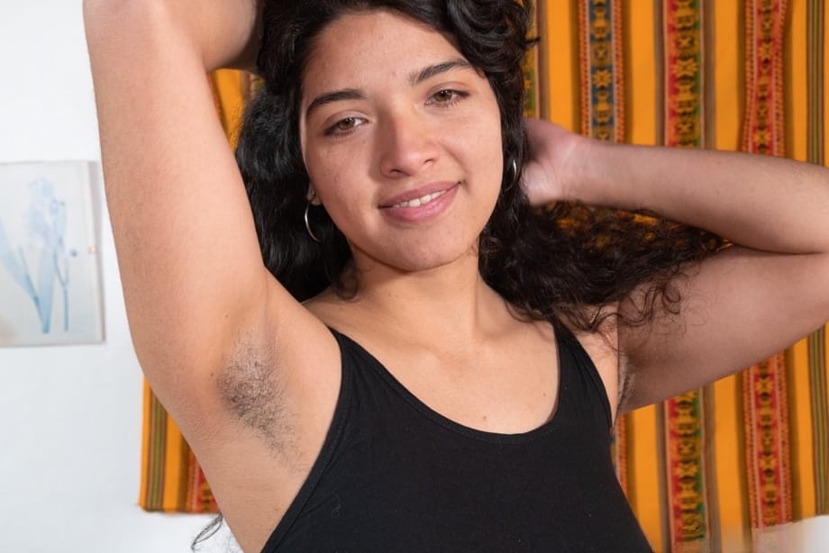 Plump amateur Maria F finger spreads her beaver after getting naked on a couch