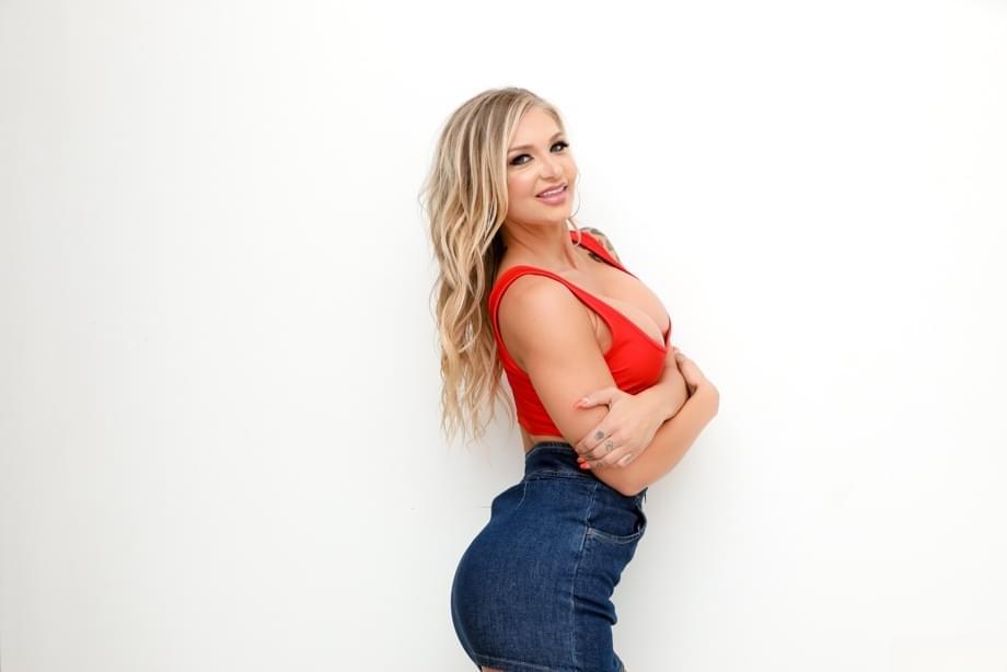 Hot blonde Alison Avery strikes great SFW poses in a denim miniskirt