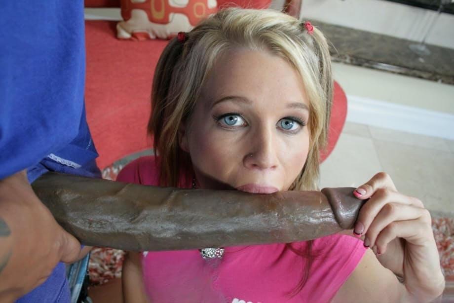 Cute blonde in shorts sucks a big black cock and gets drowned in cum