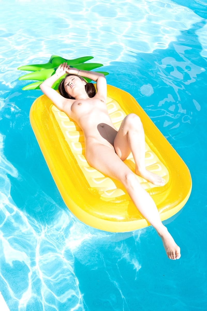 Tiny Asian teen Lulu Chu takes off her bikini while enjoying some pool time