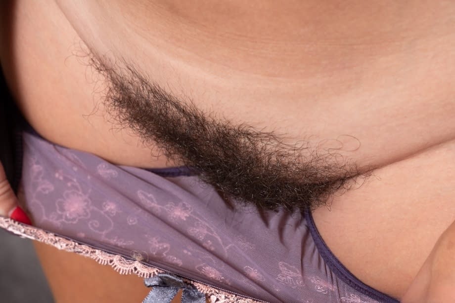 Tall female Gadget uncups her big naturals before spreading her trimmed muff