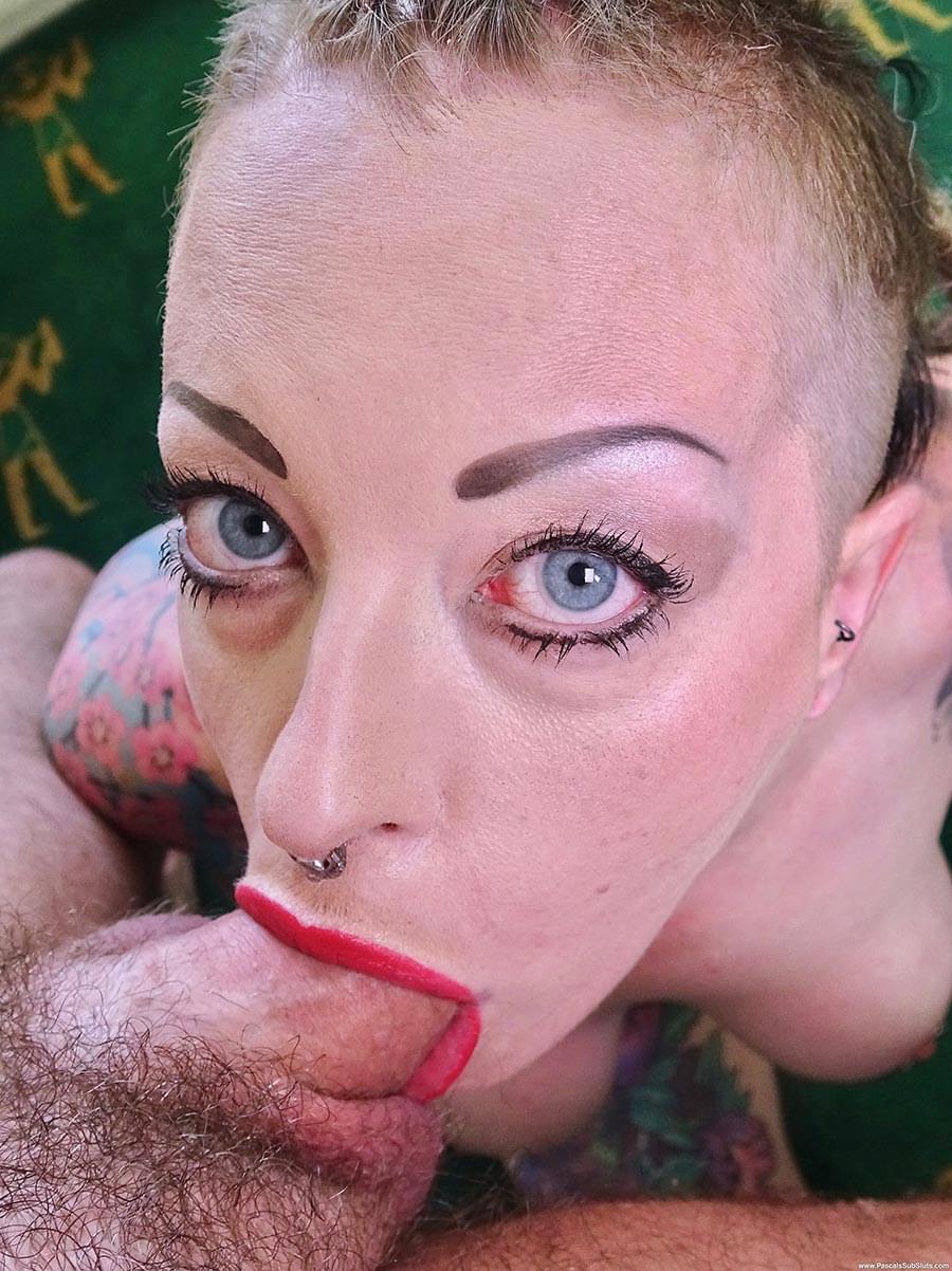Tattooed female Piggy Mouth slurps on a dick before vaginal sex