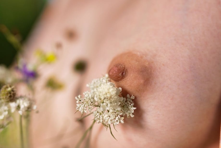 Teen girl with short blonde hair spreads her meaty labia lips in a clearing