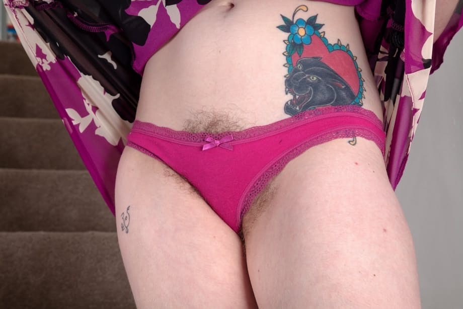 Busty amateur Betty Busen showcases her full bush on a staircase