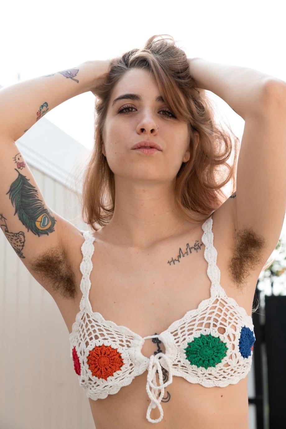 Amateur girl Pearl Sage shows off her furry pits and full bush in the nude
