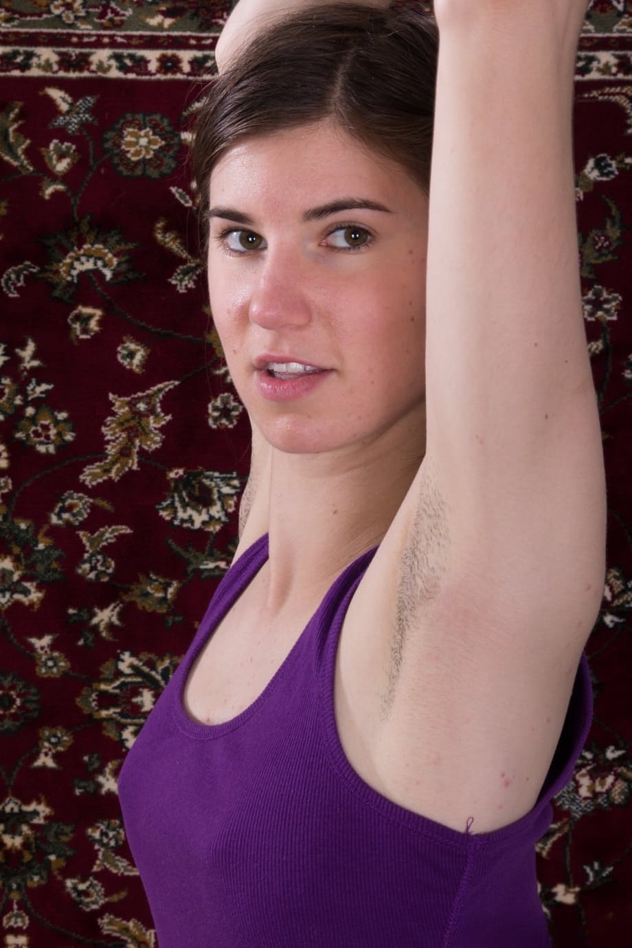 Dark haired girl with armpit stubble exposes her hairy bush