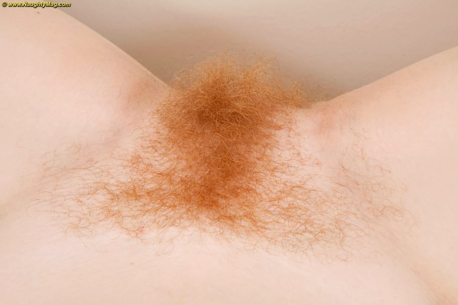 Redhead amateur Scarlett Rose displays hairy bush after getting rid of panties