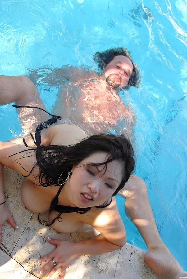 Asian MILF Alexia sucks a fat tourist's morning glory beside the pool