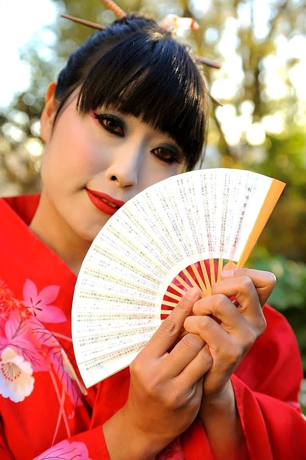 Japanese Geisha pleasures a white man she just met in a public park