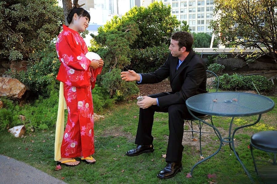 Japanese Geisha pleasures a white man she just met in a public park