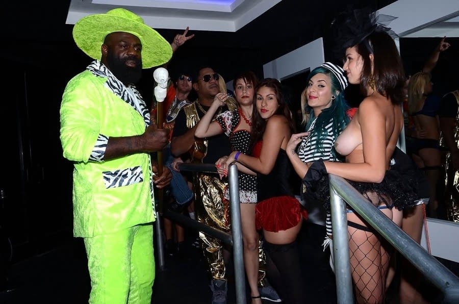 Black and white chicks in sexy outfits headline a wild orgy