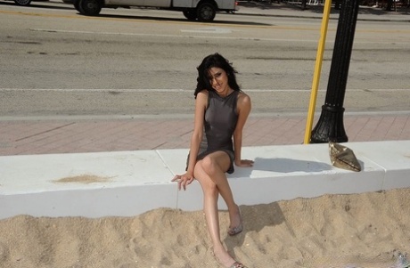 Dark haired Latina hooker flashes her ass on street to pickup up a John