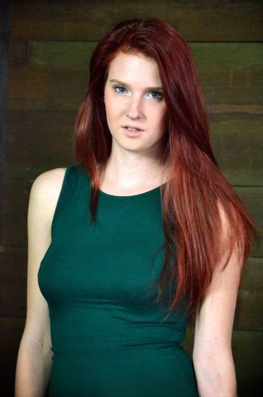 Pale redhead Ashley Lane submits to spending a day of her life in bondage