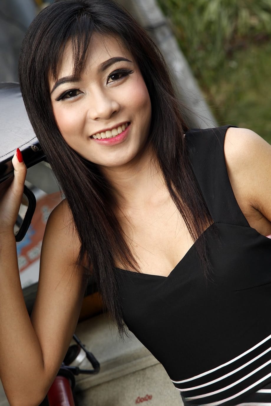 Beautiful Thai female slides pink panties over her ass to pose nude