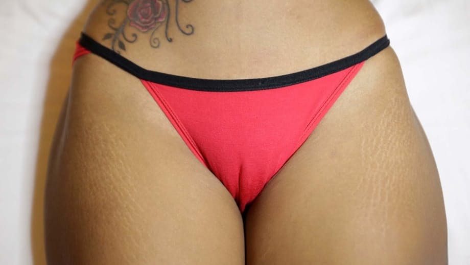 Hot Thai girl in shorts displays panty cameltoe before showing her hairy pussy