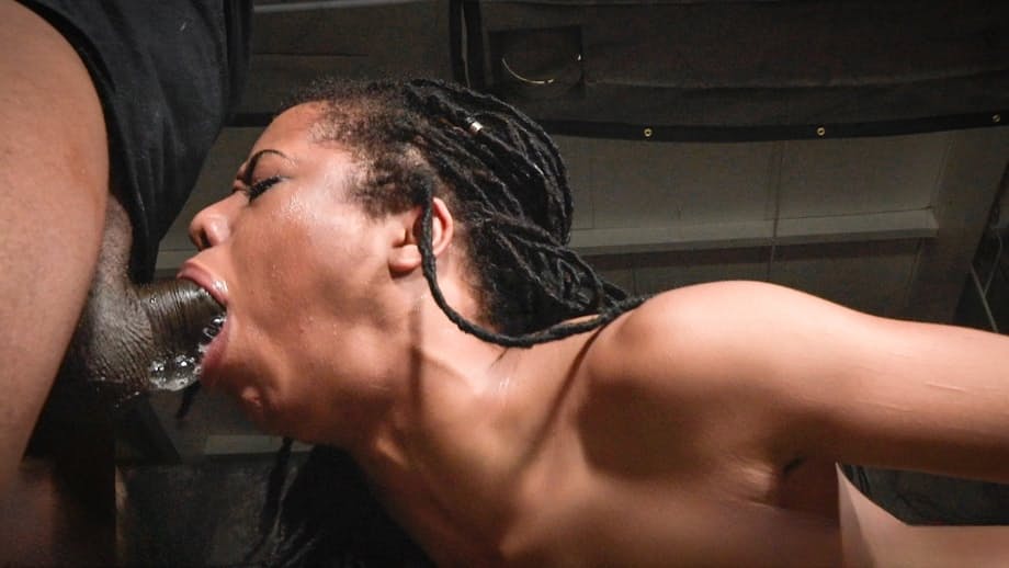 Ebony girl Kira Noir is spit roasted by black and white men in a dungeon