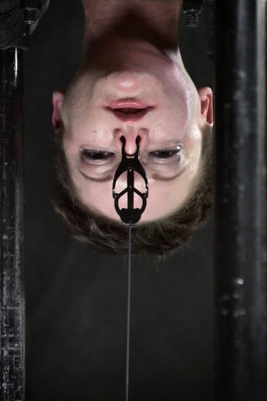 Naked teen Hazel Hypnotic is restrained and tortured in dungeon environment