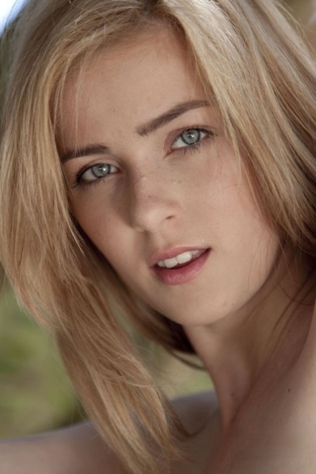 Naked blonde girl Abigaile Johnson affixes a smile to her pretty face
