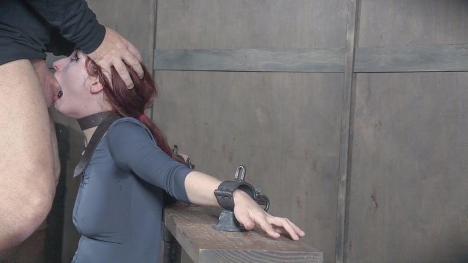 Redhead sex slave Violet Monroe is forced to deepthroat a cock