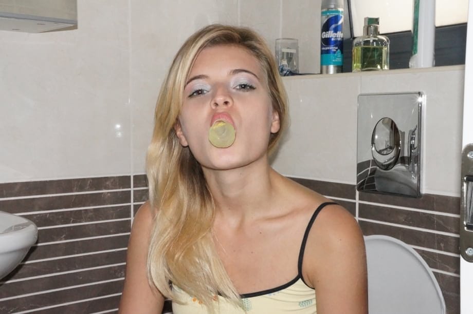Young cutie Zoey Ryder bares her tiny tits and blows bubbles on the toilet