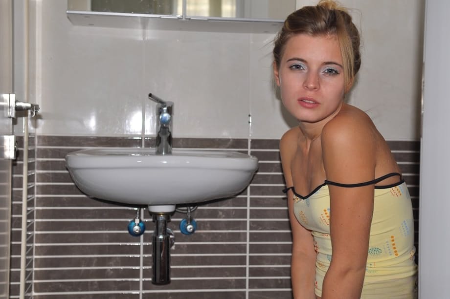 Young cutie Zoey Ryder bares her tiny tits and blows bubbles on the toilet