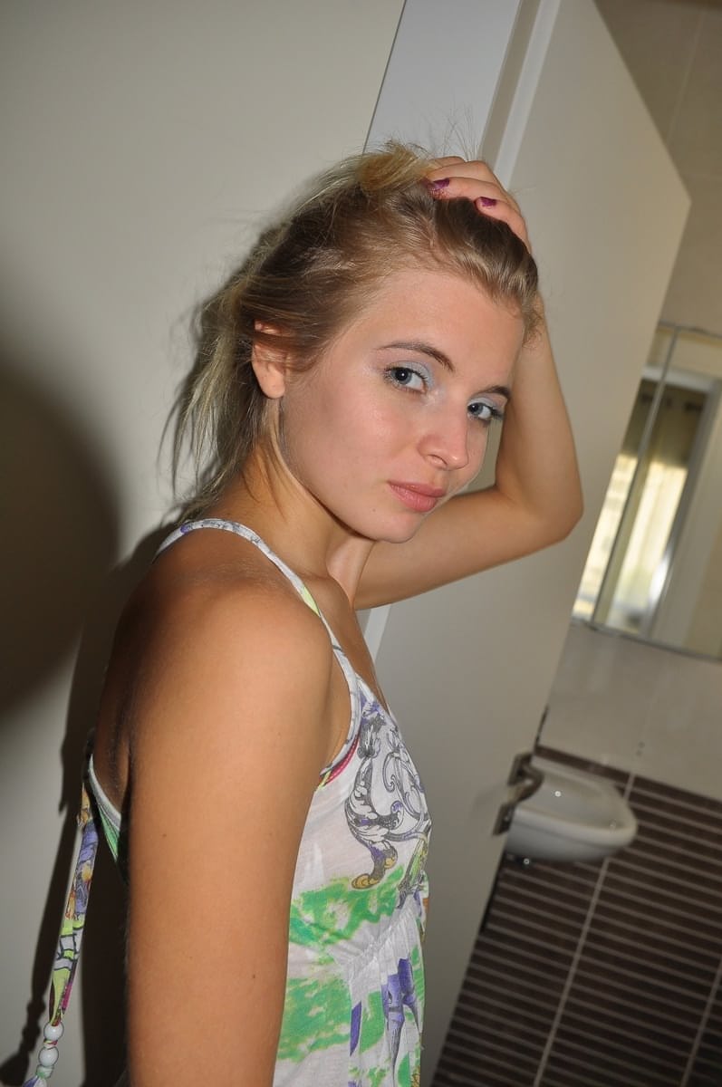 Young cutie Zoey Ryder bares her tiny tits and blows bubbles on the toilet