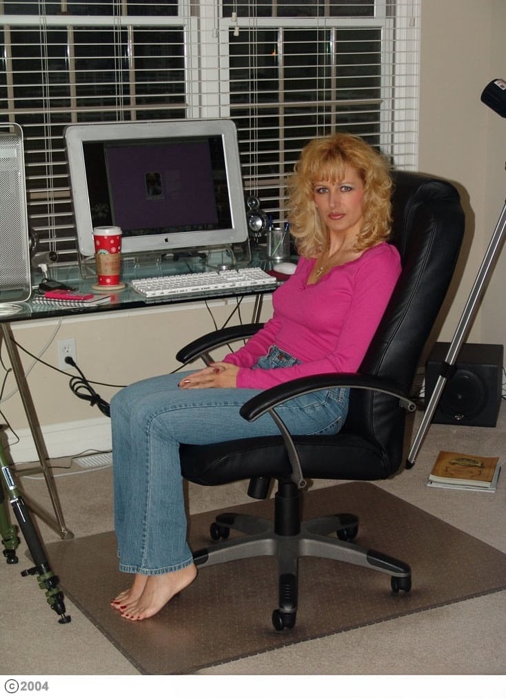 Horny mature Racquel Devonshire talks on the phone while taking a shot of cum