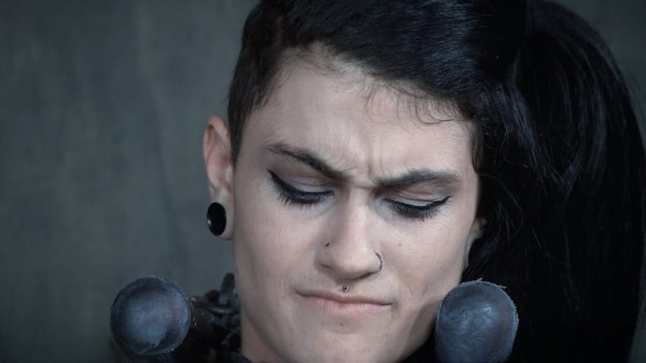 Dark haired chick Lydia Black endures facial abuse while restrained in dungeon