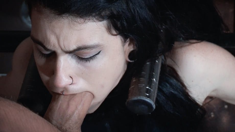 Dark haired chick Lydia Black endures facial abuse while restrained in dungeon