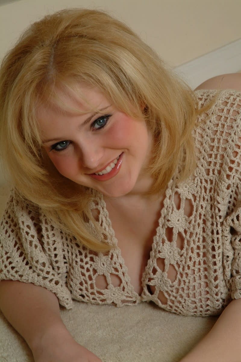 Fat amateur Ashley Ellison removes her black thong and bares huge tits